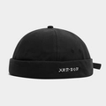 Detail of black canvas miki hat featuring white Cyrillic hip-hop embroidery text - Adjustable / Black