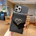 Detail of black faux leather phone wallet case with gold heart and metal chain strap - Heart Wallet Black / iphoneXR