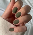 Close-up of olive green glossy square-round press-on nails on a model hand - Olive Green Glossy Squoval Style (CW297)