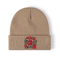 Detailed close-up of rose buds strong bond embroidery on khaki knit beanie - Khaki