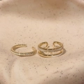 Detailed close-up of French luxury gold butterfly ring with white enamel and zircon stones - Ring Two-Piece Set / Gold