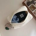 Close-up of white quilted cosmetic bag with metal zipper and soft cotton filling - Boat Shaped Pouch