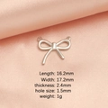 Silver steel bow tie pendant DIY jewelry charm 16.2x17.2mm on soft pink background - Steel Bow 2 Pendant