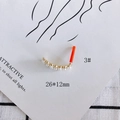 Detail of heart cross pearl earring pendant with red protective sleeve on 26x12mm post - 3# Pearl Row Arc Shape