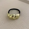 Minimalist golden twisted metal hair tie with black elastic rope in a vintage style - Twisted Smooth Gold