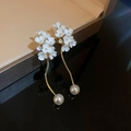 Close-up of elegant white flower earrings with gold chain and pearl drops sparkle - Style 2 Silver Post