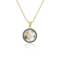 Detailed shot of gold plated Capricorn pendant with blue stones and shell inlay - Capricorn