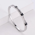 Gepolijste zilveren titanium stalen armband met vierkante zwarte en witte strass - Staalkleur
