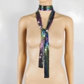 Close-up of rainbow metallic sequin mesh scarf necklace draped on a white mannequin - Iridescent Black Aluminum Sequin