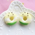 Macro shot of colorful resin donut charms with cute expressions in a ceramic dish - Light Yellow Base