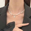 French style silver necklace with pearls and textured pendant worn on black suit - Artificial Pearl Round Textured Pendant Necklace (9721) / Bright Silver