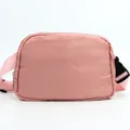 Detail of pink nylon running belt bag showing high-density fabric and durable plastic buckle - Sweet Pink