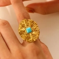 Hammered gold statement ring with a square blue stone detail on female hand - Gold (1827)