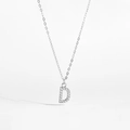 Macro shot of silver letter D pendant necklace featuring sparkling cubic zirconia stones - 925 Silver / Letter D