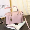 Chic pink PU leather Boston bag with handles and shoulder strap on a fashion magazine - Large / Pink Purple