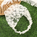 White daisy lace headband with elastic band displayed on green grass background - White Daisy