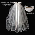 Detail of white double-layer short bridal veil with satin bow and 55cm length - Double Layer Ruffled Bow Hair Clip (65CM)