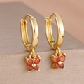 Detail shot of 18k gold plated butterfly earrings featuring orange cubic zirconia stones - Butterfly Drop Earrings (Y27359) / Two-Piece Set / Gold-Red
