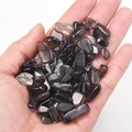 Polished dark and clear natural crystal quartz stones held in palm for decor - Smoky Quartz (100g)