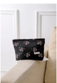 Close-up of vintage black fabric cosmetic bag with pink berry embroidery and brand label - 26cm x 18cm / Pink Large