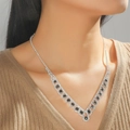 Elegant silver V-shaped necklace with black round gemstone displayed on model neck - Black Oval Silver 2-Piece Set(DTN14027052BK)