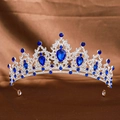 Elegant silver bridal tiara with intricate filigree and blue teardrop crystal stones - Silver Royal Blue