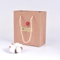 Brown kraft paper gift bag with hemp rope handles and decorative floral sticker - Kraft Paper with Rose