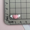 Macro detail of pink winged heart resin charm with ruler showing 2.5cm size - Winged Heart-Pink White