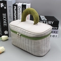 Quilted beige cosmetic bag with green handles and zippers in a minimalist scene - Large / Gray