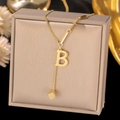 Close-up of golden titanium steel necklace with letter B pendant and square charm detail - Letter B-Gold