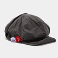 Dettaglio del cappello newsboy grigio scuro con tessuto strutturato e pompon colorati - Taglia unica / grigio scuro