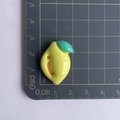 Detail view of 2cm yellow lemon resin charm for DIY phone cases and stationery - Yellow Lemon