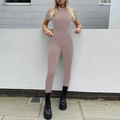 Detail of short sleeve mock neck yoga jumpsuit in dusty pink with slim fit design - Nude