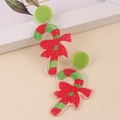 Detail of Christmas candy cane earrings with red bow and glittery acrylic finish - Candy Cane