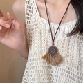 Bohemian wax rope necklace with vintage round metal pendant and tassel detailing - Rhinestone Hollow Flower Tassel (18#)