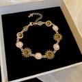 Vintage gold bracelet with white pearls and olive green sunflower crystals - Rose Gold (Green Stone)