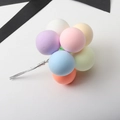 Macro shot of colorful clay balloon cake toppers in pastel pink, blue and yellow - Ball Bundle / Macaron Pastel Ball Bundle