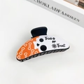 Gothic Halloween hair claw clip with Trick or Treat text and skull design on orange base - Halloween #7 - Crescent