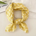 Elegant yellow plaid cotton linen small square scarf with a knotted finish on a beige surface - Cross Ball Yellow
