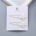 Pair of girls' star hair clips with white glitter finish on card packaging - White Star Pair