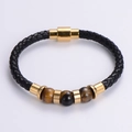 Detail of woven black leather bracelet with magnetic gold clasp and Tiger Eye stones - Gold Tiger Eye Style