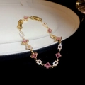 Macro view of gold-plated bracelet with square pink crystals and pavé diamond details - No.25 Pink Square Zircon Patchwork Bracelet-Gold-Pink
