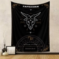 Detail of Capricorn zodiac tapestry with gold and white silk-screen printing on black fabric - Capricorn