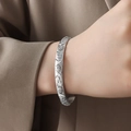 Silver bracelet with sun moon star relief worn on wrist, elegant French court style - Silver Bangle / Silver