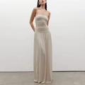 Detail of elegant cream strapless maxi dress featuring pleated bodice and flowing skirt - S / White
