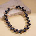 Detailed view of vintage gold necklace with deep blue beads and adjustable chain extension - Necklace-Blue