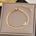 Detail of double-layer gold snake chain bracelet with heart charm and Love lettering - Gold Double Layer Love Heart Style (5213)