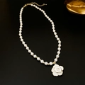 Detail of a white camellia flower pendant with pearl and gold chain on black background - 2# Necklace - Gold Camellia Pearl
