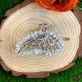 Detail of silver alloy hair claw with clear natural crystal stones on a rustic wood slice - Clear Quartz Silver Butterfly