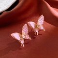 Macro detail of pink butterfly earring with gold edges and crystals on red silk cloth - No. 25 925 Sterling Silver Earring Post Purple
